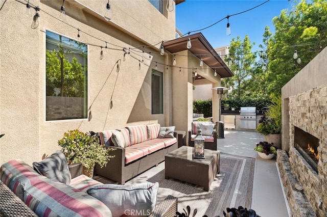 131 Spiral, Irvine, CA 92618 - view of patio featuring an outdoor living space with a fireplace and an outdoor kitchen