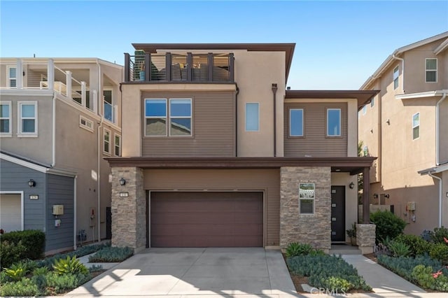131 Spiral, Irvine, CA 92618 - multi unit property featuring stone siding, an attached garage, driveway, and stucco siding