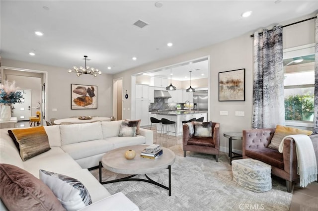 131 Spiral, Irvine, CA 92618 - living area with a chandelier and recessed lighting