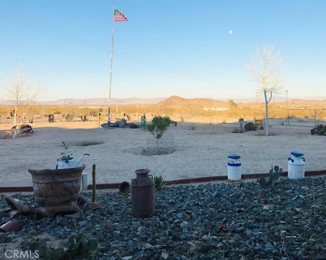 61975 La Brisa Dr, Joshua Tree, CA 92252 - view of yard featuring a view of rural / pastoral area and a mountain view