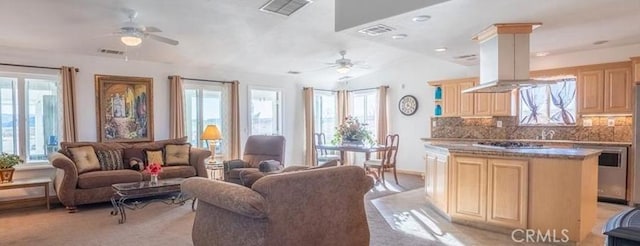61975 La Brisa Dr, Joshua Tree, CA 92252 - living room featuring ceiling fan, healthy amount of natural light, vaulted ceiling, and recessed lighting