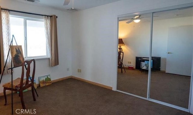 61975 La Brisa Dr, Joshua Tree, CA 92252 - unfurnished bedroom with carpet floors, a closet, and a ceiling fan