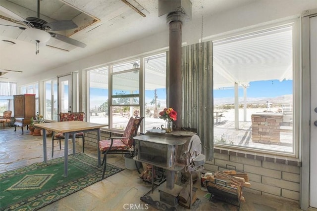 61975 La Brisa Dr, Joshua Tree, CA 92252 - sunroom / solarium featuring plenty of natural light and stone finish flooring
