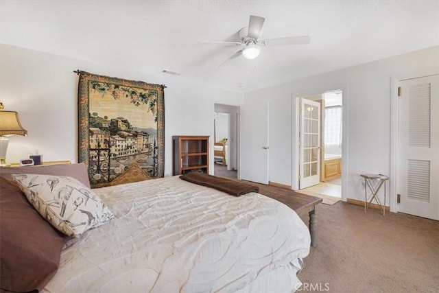 61975 La Brisa Dr, Joshua Tree, CA 92252 - bedroom with carpet flooring, connected bathroom, and ceiling fan