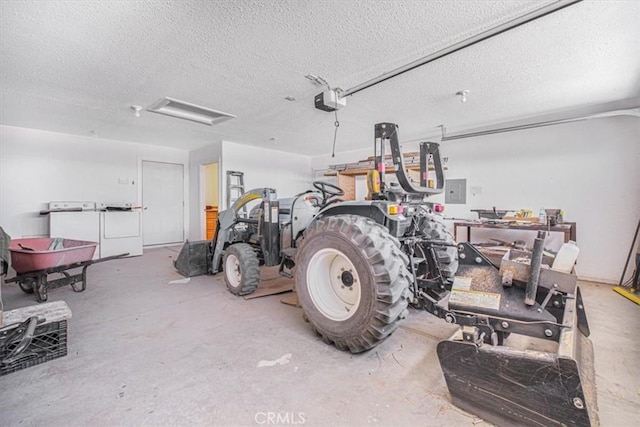 61975 La Brisa Dr, Joshua Tree, CA 92252 - garage with a garage door opener and washing machine and clothes dryer