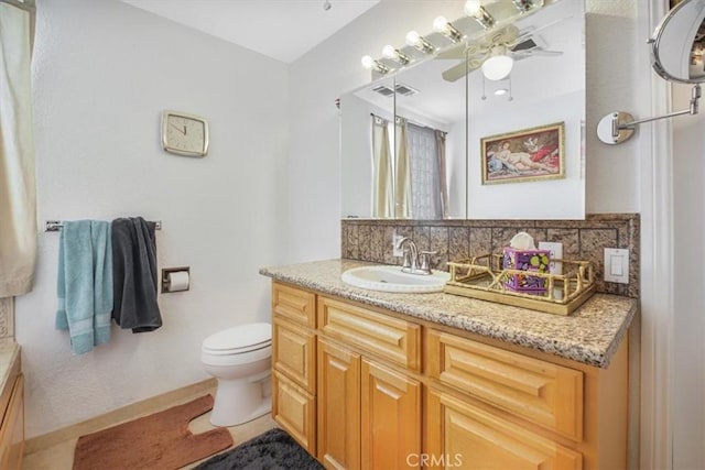 61975 La Brisa Dr, Joshua Tree, CA 92252 - full bath featuring vanity, ceiling fan, and backsplash