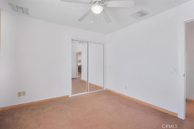 61975 La Brisa Dr, Joshua Tree, CA 92252 - unfurnished bedroom with carpet floors, a closet, and ceiling fan