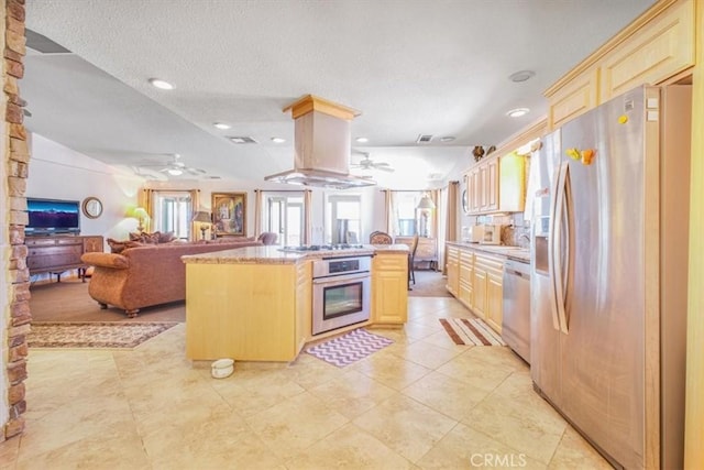 61975 La Brisa Dr, Joshua Tree, CA 92252 - kitchen with appliances with stainless steel finishes, ceiling fan, light brown cabinets, recessed lighting, and a textured ceiling