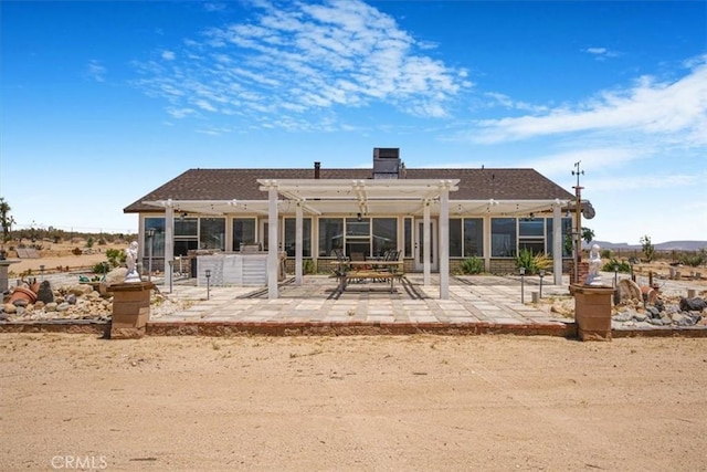 61975 La Brisa Dr, Joshua Tree, CA 92252 - rear view of house with a pergola and a patio