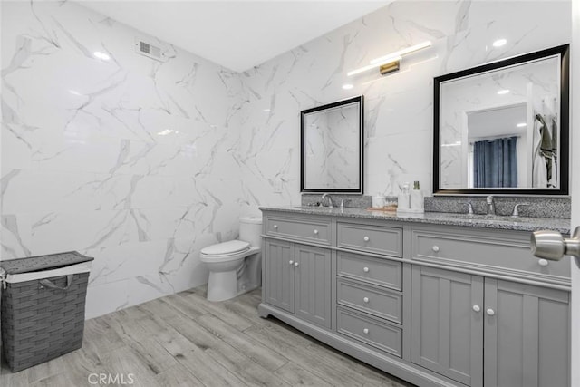 8801 Cedros Ave Unit 7, Panorama City, CA 91402 - full bath featuring tile walls, double vanity, and wood finished floors