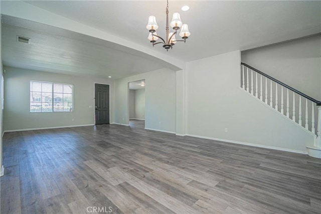 11935 Silver, Jurupa Valley, CA 91752 - unfurnished living room with a chandelier, wood finished floors, and stairs