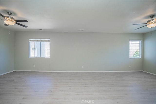 11935 Silver, Jurupa Valley, CA 91752 - empty room featuring a ceiling fan, plenty of natural light, and light wood-style floors
