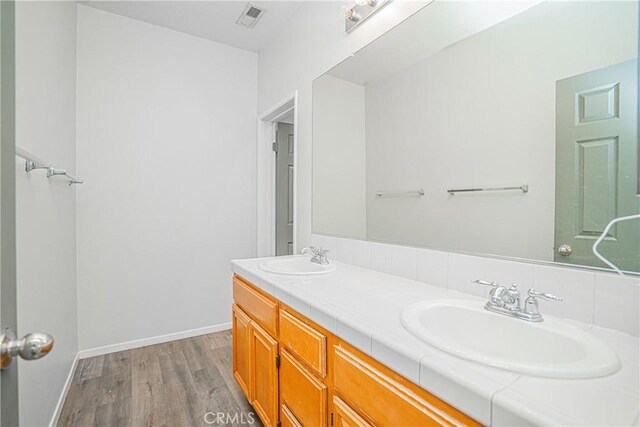 11935 Silver, Jurupa Valley, CA 91752 - full bathroom featuring double vanity and wood finished floors