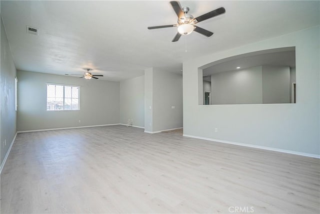 11935 Silver, Jurupa Valley, CA 91752 - unfurnished room with a ceiling fan, wood finished floors, and arched walkways