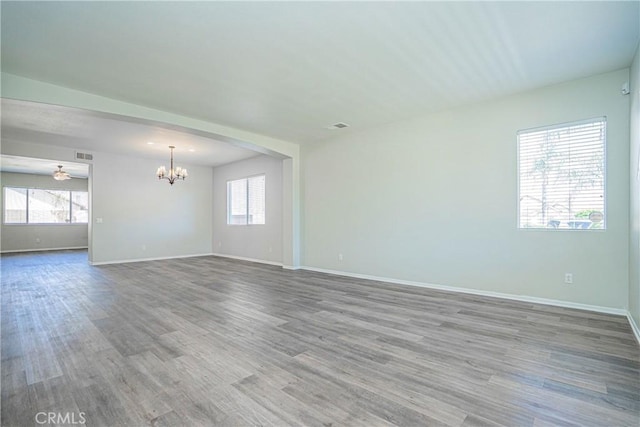 11935 Silver, Jurupa Valley, CA 91752 - empty room with a chandelier and wood finished floors