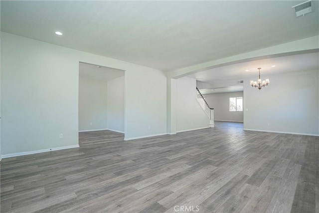 11935 Silver, Jurupa Valley, CA 91752 - unfurnished living room with a chandelier, wood finished floors, stairway, and recessed lighting