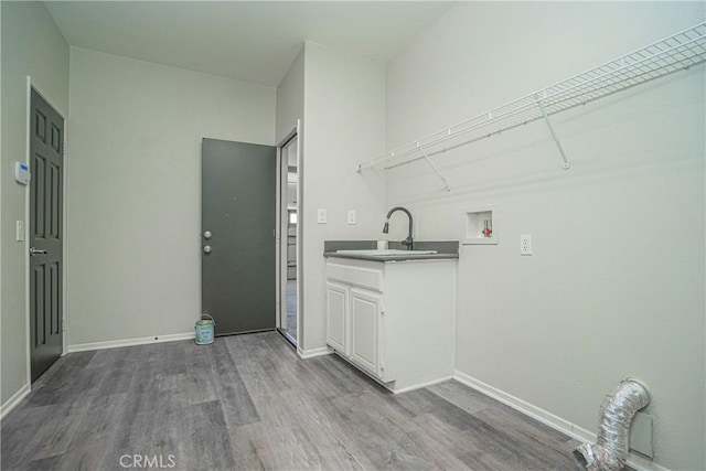11935 Silver, Jurupa Valley, CA 91752 - washroom featuring wood finished floors, cabinet space, and washer hookup