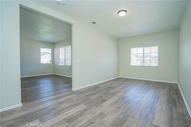 11935 Silver, Jurupa Valley, CA 91752 - empty room featuring healthy amount of natural light and wood finished floors