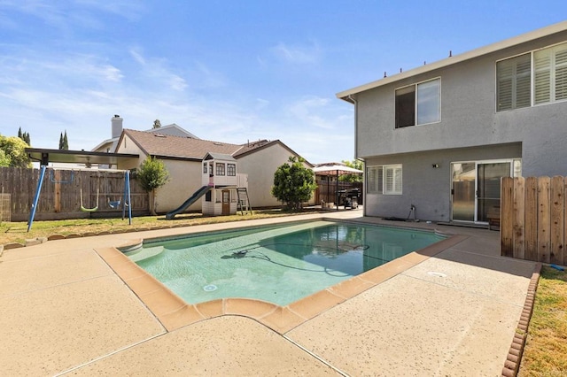 8041 Lomand Ct, Sacramento, CA 95828 - view of pool featuring a playground, a fenced backyard, and a patio