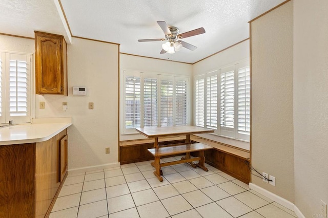 8041 Lomand Ct, Sacramento, CA 95828 - dining area with ceiling fan, a textured ceiling, crown molding, and light tile patterned floors