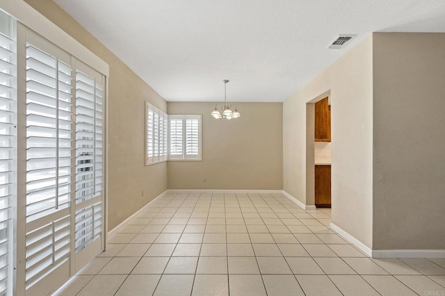 8041 Lomand Ct, Sacramento, CA 95828 - spare room with a chandelier and light tile patterned flooring