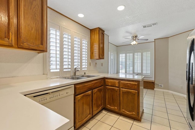 8041 Lomand Ct, Sacramento, CA 95828 - kitchen featuring dishwasher, ceiling fan, light countertops, a peninsula, and a textured ceiling
