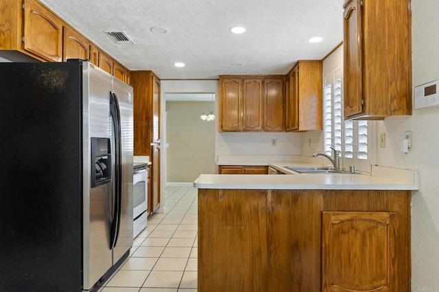 8041 Lomand Ct, Sacramento, CA 95828 - kitchen featuring stainless steel fridge with ice dispenser, a peninsula, brown cabinets, light tile patterned flooring, and recessed lighting