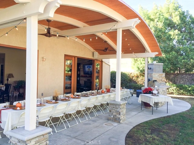 1073 Peter Christian Cir, Corona, CA 92881 - view of patio with a ceiling fan, a fireplace, and an outdoor bar