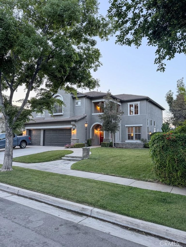 1073 Peter Christian Cir, Corona, CA 92881 - view of front of home featuring an attached garage, stucco siding, driveway, and a front yard