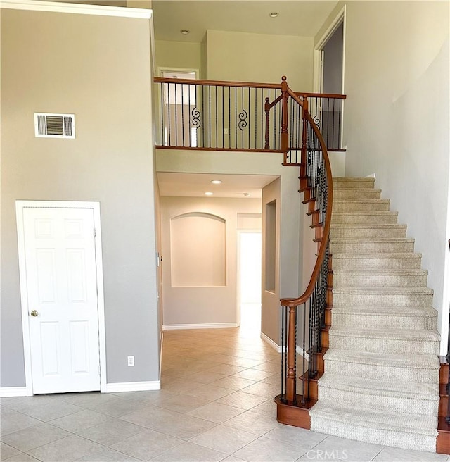 1073 Peter Christian Cir, Corona, CA 92881 - stairway featuring tile patterned floors and a towering ceiling
