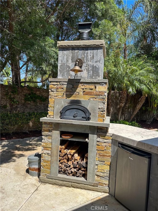 1073 Peter Christian Cir, Corona, CA 92881 - view of patio / terrace with exterior fireplace and exterior kitchen
