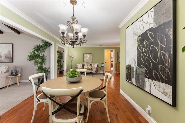 1915 Volk Ave, Long Beach, CA 90815 - dining space featuring a chandelier, wood finished floors, and ornamental molding