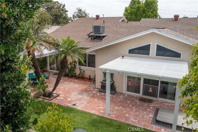 1915 Volk Ave, Long Beach, CA 90815 - rear view of house with stucco siding, a shingled roof, and a patio