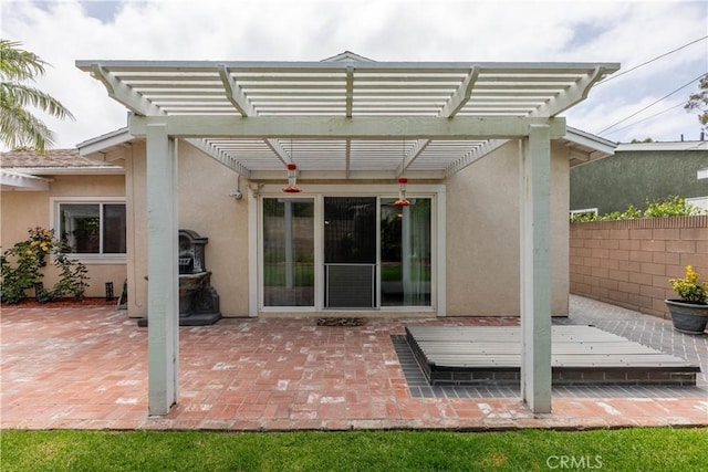 1915 Volk Ave, Long Beach, CA 90815 - back of property featuring stucco siding, a pergola, and a patio area
