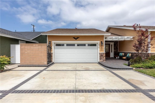 1915 Volk Ave, Long Beach, CA 90815 - view of front facade featuring a garage, concrete driveway, stone siding, and roof with shingles