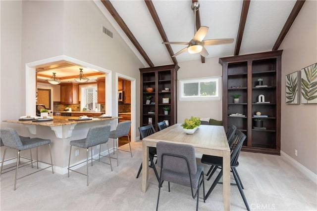 1915 Volk Ave, Long Beach, CA 90815 - dining area with light colored carpet and ceiling fan