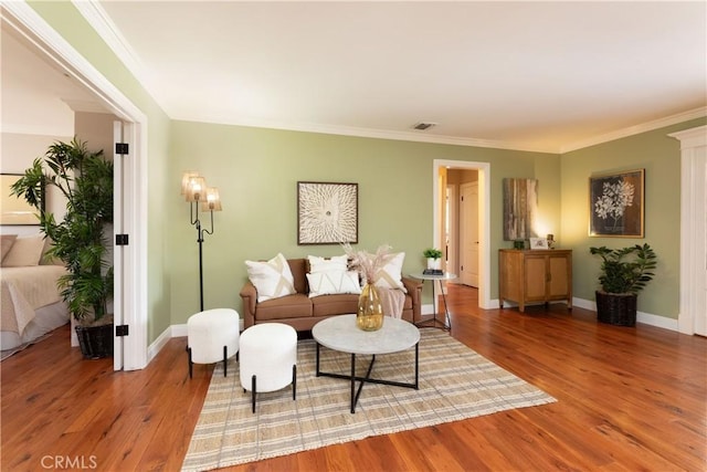 1915 Volk Ave, Long Beach, CA 90815 - living area with light wood-style flooring and ornamental molding
