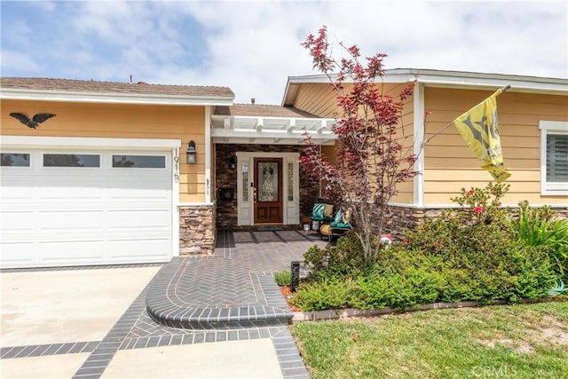 1915 Volk Ave, Long Beach, CA 90815 - view of front of property with a garage, stone siding, and concrete driveway