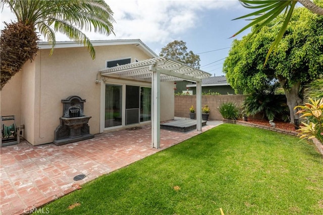 1915 Volk Ave, Long Beach, CA 90815 - back of house with stucco siding, a pergola, and a patio