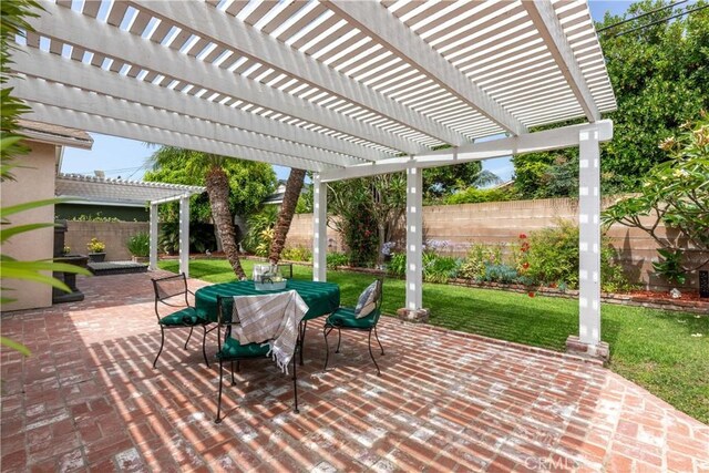 1915 Volk Ave, Long Beach, CA 90815 - fenced backyard with outdoor dining space, a patio, and a pergola