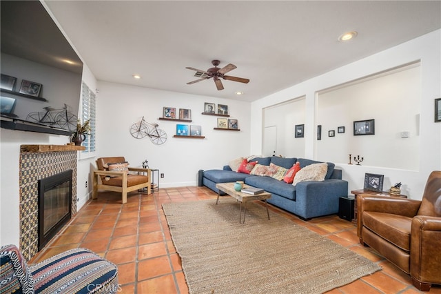 30050 Cabo Del Oeste, Highland, CA 92346 - tiled living room featuring a tile fireplace, a ceiling fan, and recessed lighting
