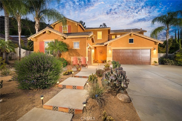 30050 Cabo Del Oeste, Highland, CA 92346 - mediterranean / spanish-style home featuring stucco siding, concrete driveway, an attached garage, and a tile roof