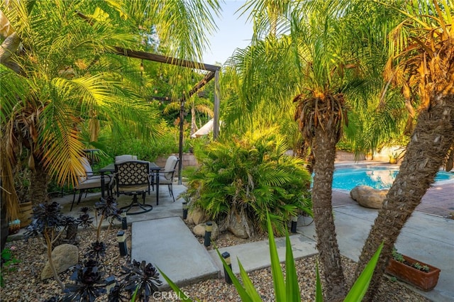 30050 Cabo Del Oeste, Highland, CA 92346 - view of patio / terrace with an outdoor pool and outdoor dining area
