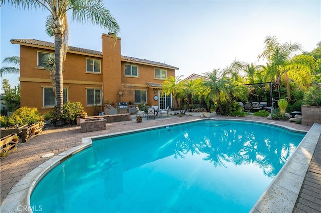 30050 Cabo Del Oeste, Highland, CA 92346 - outdoor pool featuring a patio and a fire pit