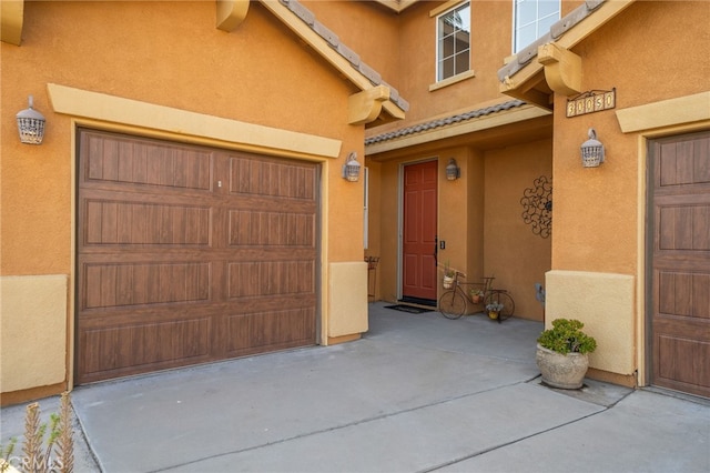 30050 Cabo Del Oeste, Highland, CA 92346 - entrance to property with a garage, stucco siding, and a tile roof