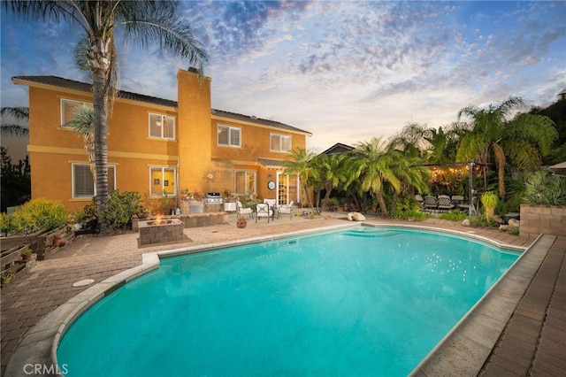 30050 Cabo Del Oeste, Highland, CA 92346 - outdoor pool with a patio area, area for grilling, and an outdoor living space with a fire pit