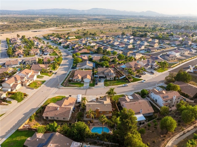 30050 Cabo Del Oeste, Highland, CA 92346 - aerial view of property's location featuring a mountainous background and nearby suburban area