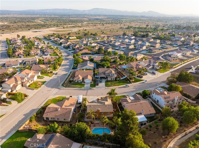 30050 Cabo Del Oeste, Highland, CA 92346 - aerial view of property and surrounding area with mountains and nearby suburban area