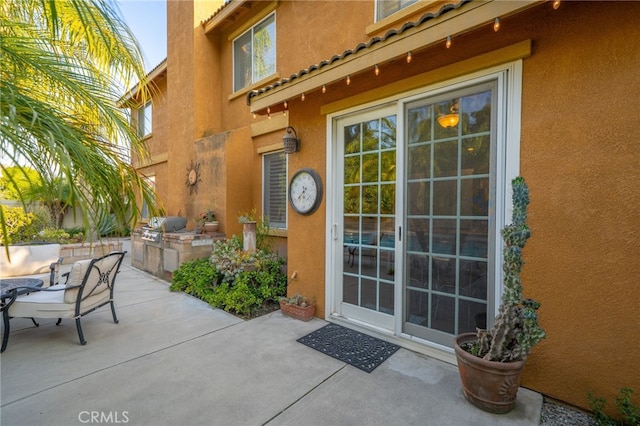 30050 Cabo Del Oeste, Highland, CA 92346 - entrance to property with area for grilling, stucco siding, a patio, and a tiled roof