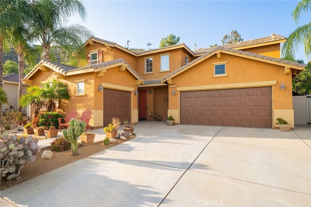 30050 Cabo Del Oeste, Highland, CA 92346 - view of front of property with stucco siding, driveway, an attached garage, and a tiled roof